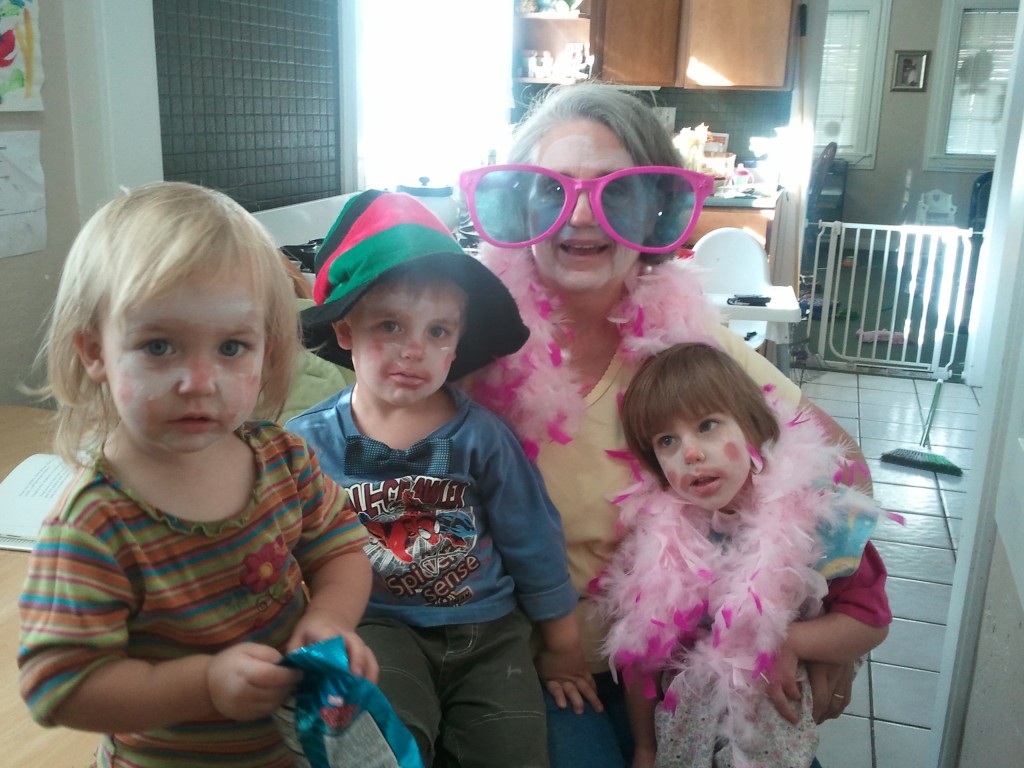 grandma and grandkids dressed as  clowns