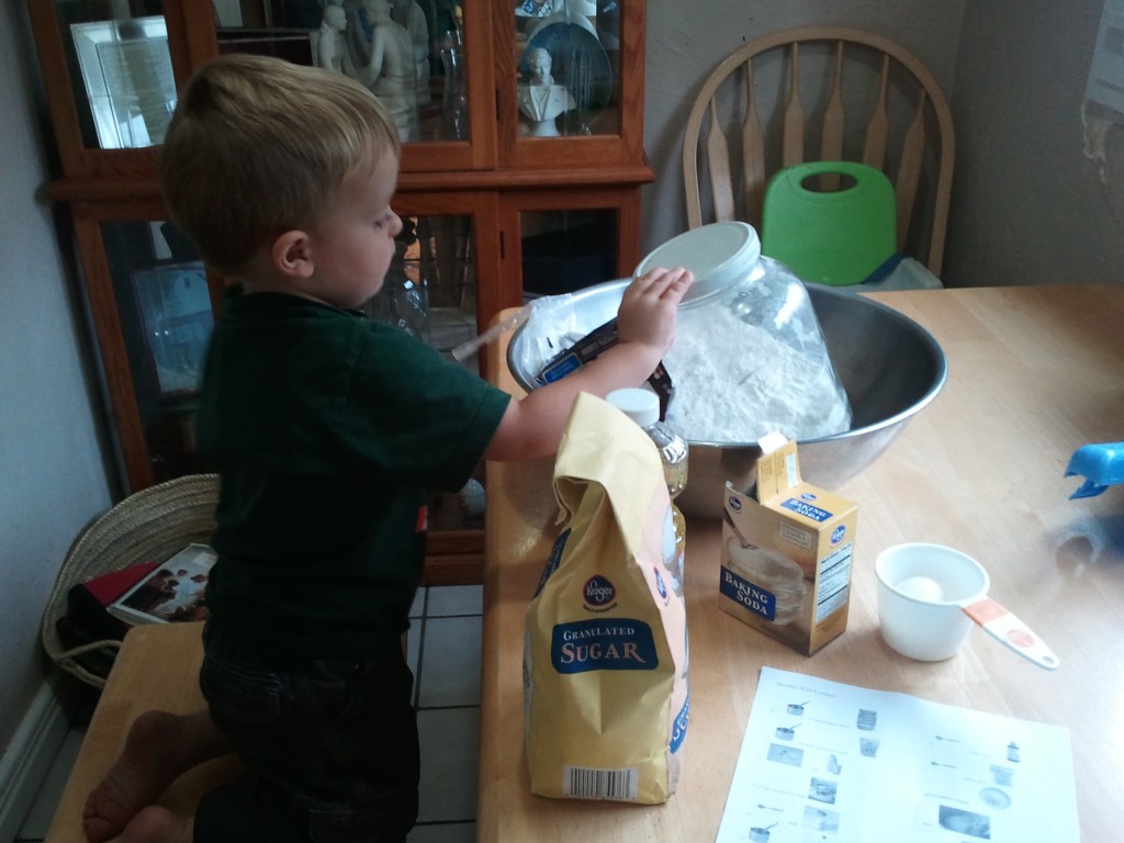 kid measuring for cookies picture