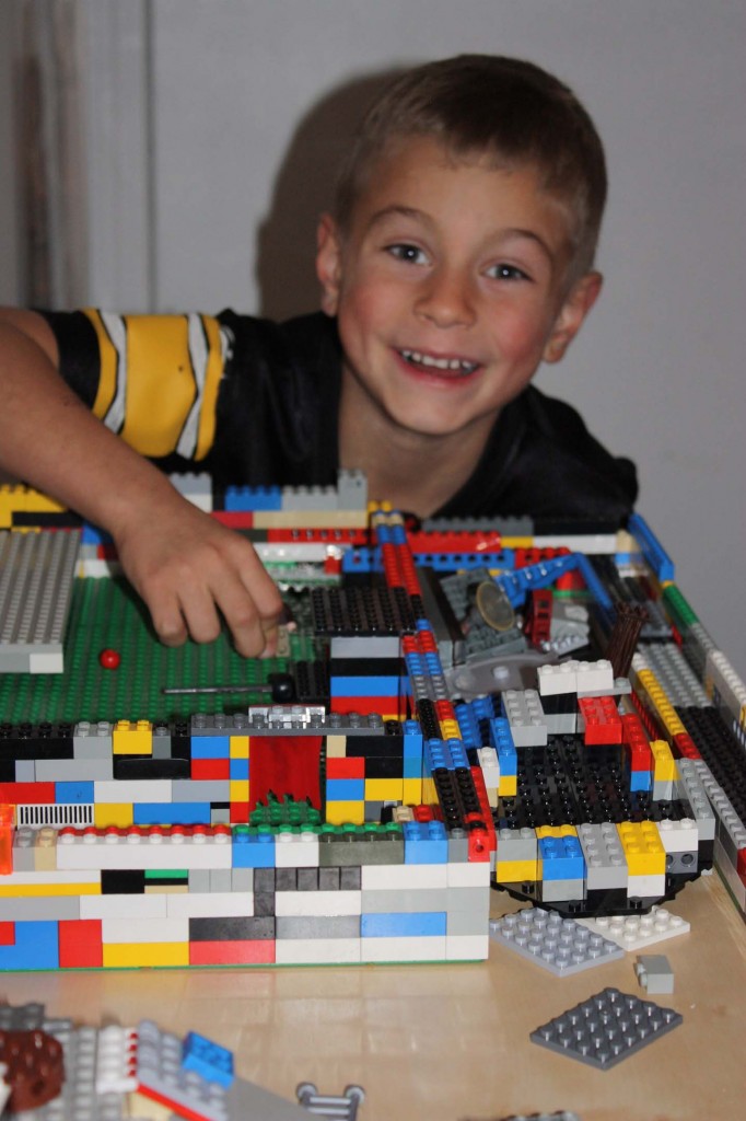 kid making legos structure picture