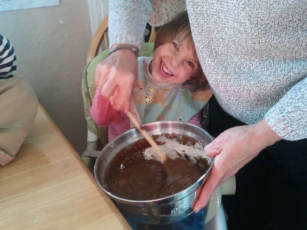kids making muffin batter 