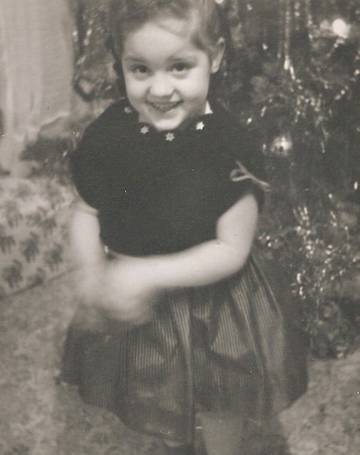 black and white photo of little girl smiling
