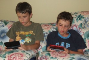 kids busy playing ps3 picture