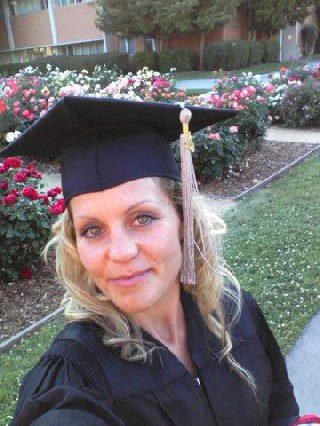 Jenny in graduation gown cap