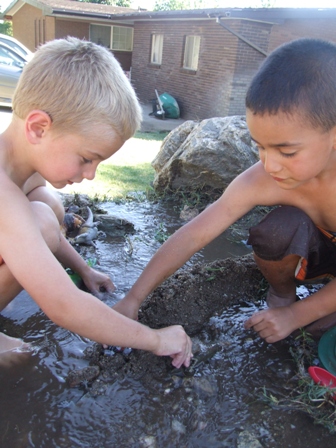 Boys playing in the mud