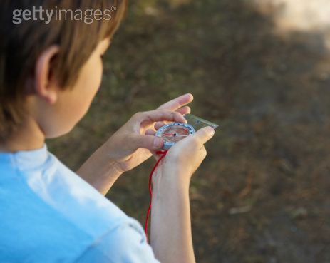 kid with compass picture