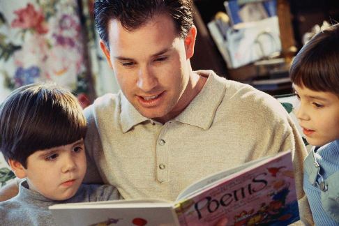 father son reading picture