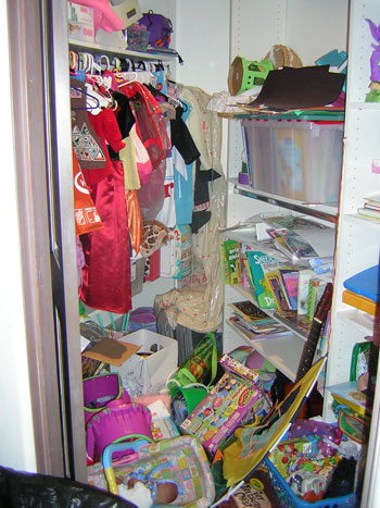 unorganized toy closet picture