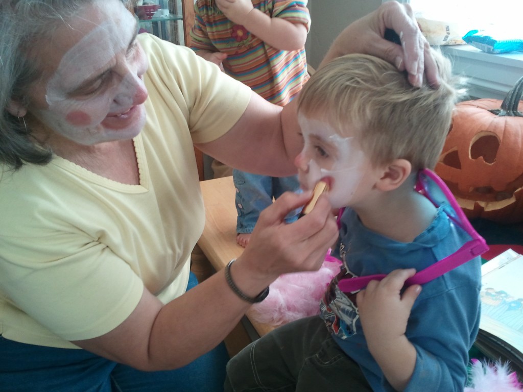 kids putting makeup to be clowns 