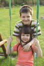 kids playing on a swing set