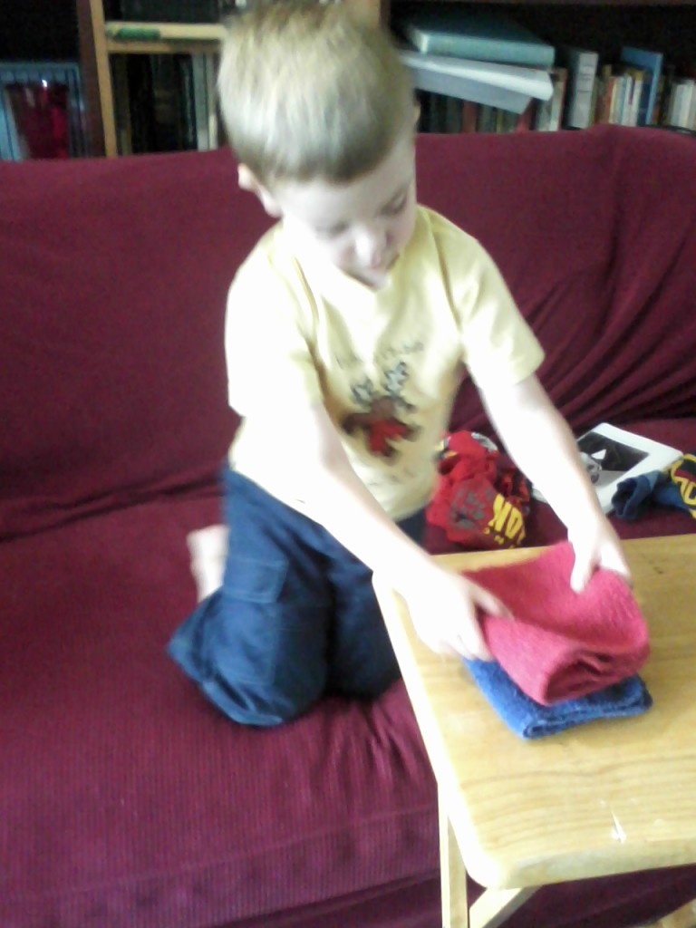 Jack folding dish towels.
