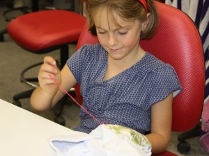 Child sewing