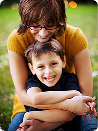 Mom_hugging_boy_outside_BRAND_PHO_EN